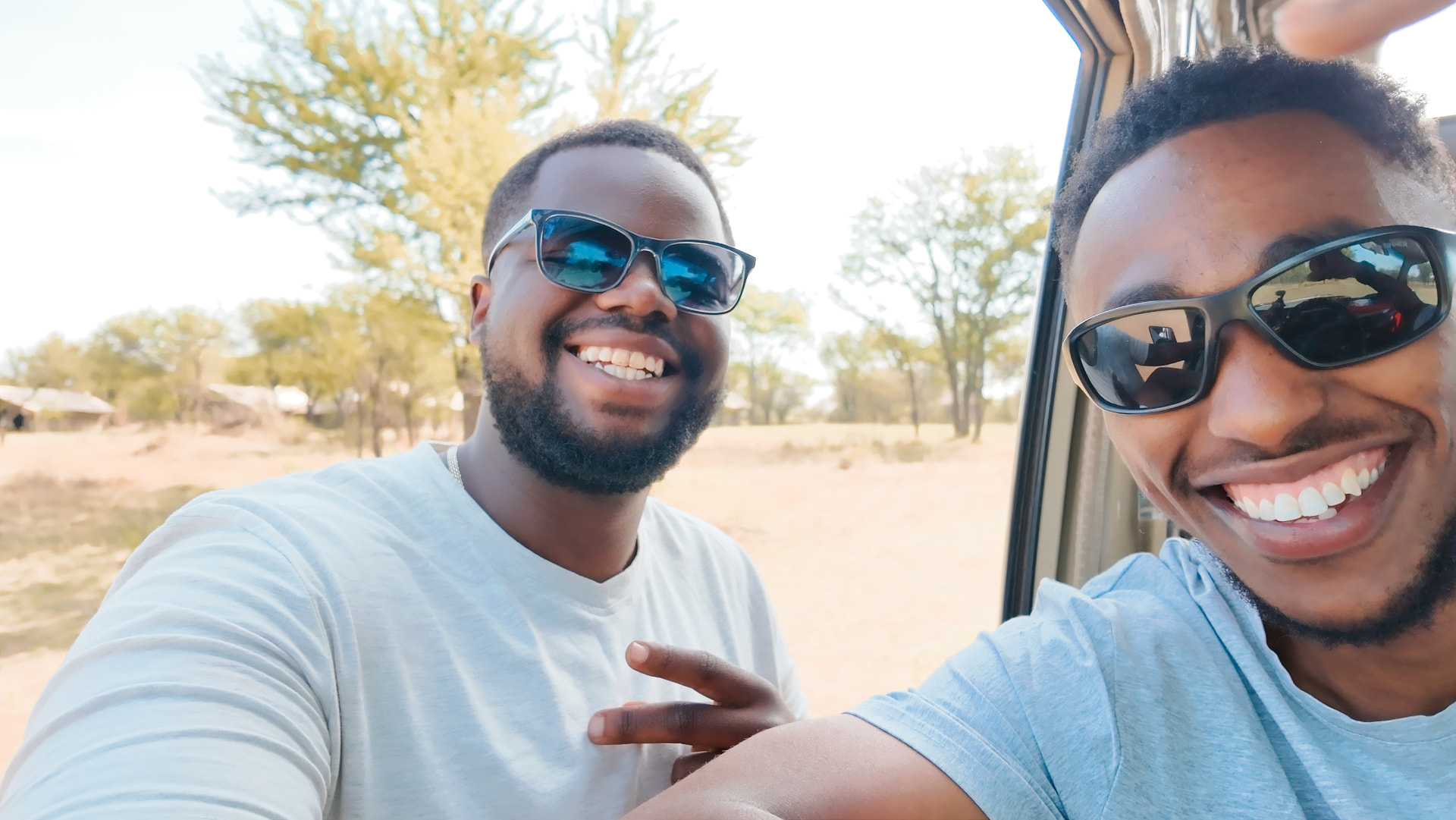 Johnson and Wiseman, selfie in the jeep