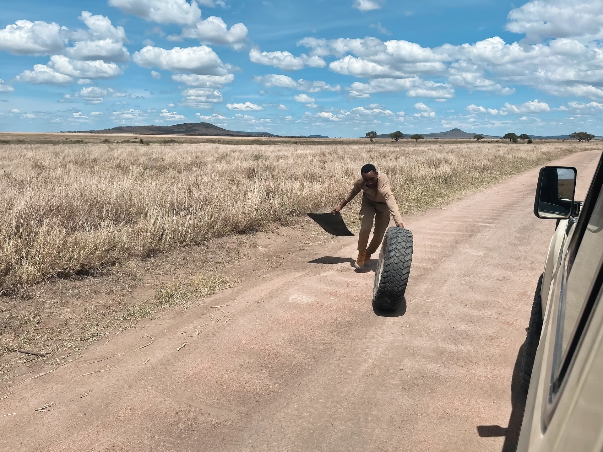 Changing a tire in the Serengeti